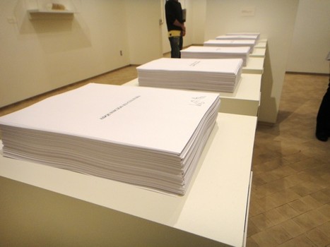 'Selbstbedienug (Self-Service/Autoservicio),' a piece by Camnitzer from 1996, in which museum viewers are invited to take sheets of paper printed with aphorisms in Spanish.